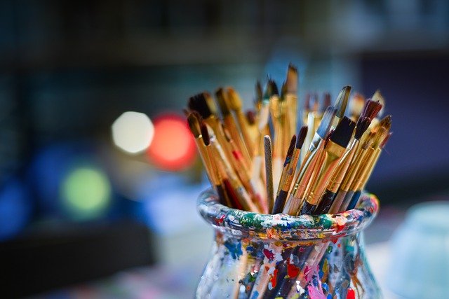 Paint brushes in pot.