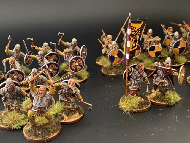 Group shot of 28mm viking figures with shields and banners.